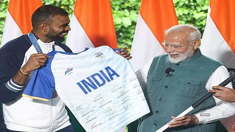 Retired Indian hockey star P R Sreejesh and PM Narendra Modi