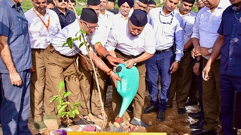 RSS chief Mohan Bhagwat plants a saplings during a plantation drive under the 'Ek Ped Maa Ke Naam' campaign, at the Matri Van in Alwar. 