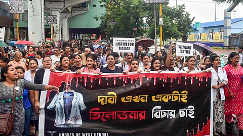 Medics take part in a protest march to Swasthya Bhavan over the alleged sexual assault and murder of a trainee doctor, in Kolkata, Sunday, Sept. 15, 2024.