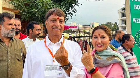 BJP candidate from Shri Mata Vaishno Devi constituency Baldev Raj Sharma and others show their fingers marked with indelible ink after casting votes during the second phase of Jammu and Kashmir Assembly elections, in Reasi district. 