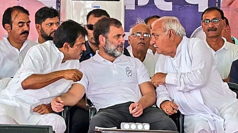 Leader of Opposition in Lok Sabha and Congress leader Rahul Gandhi with party leaders Bhupinder Singh Hooda and K.C. Venugopal during a public meeting ahead of Haryana Assembly elections, in Mahendragarh district, Haryana, Thursday, Oct. 4, 2024.