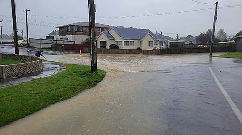 Dunedin, New Zealand, records its wettest day in century as flooding cuts city off by road   