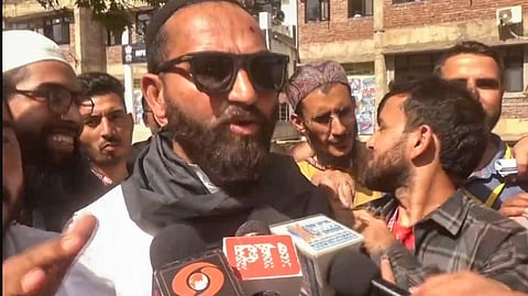 AAP candidate Mehraj Malik talks to the media after he won from Doda Assembly seat, in Doda, J & K, Tuesday, Oct. 8, 2024. 