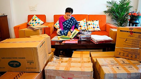 Delhi CM Atishi at work at her new residence in New Delhi, Thursday, Oct. 10, 2024.
