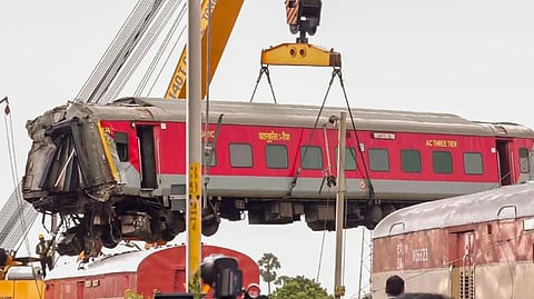 Restoration work underway after Mysuru-Darbhanga Bagmati Express train collided with a stationary goods train on Friday, at Kavarapettai near Chennai, Saturday, Oct. 12, 2024. 