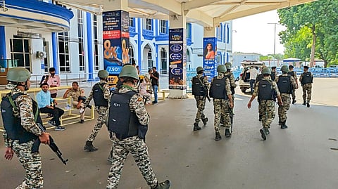 Security personnel keep a vigil after a flight made an emergency landing at the airport following an alleged bomb threat, in Jodhpur, Sunday, Oct. 20, 2024.