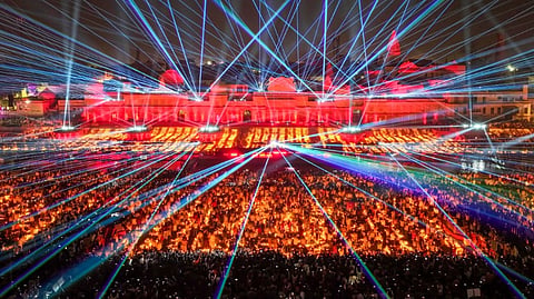 A top view of a laser show at a ghat on the banks of the Saryu River during 'Deepotsav 2024' on the eve of the 'Diwali' festival, in Ayodhya.