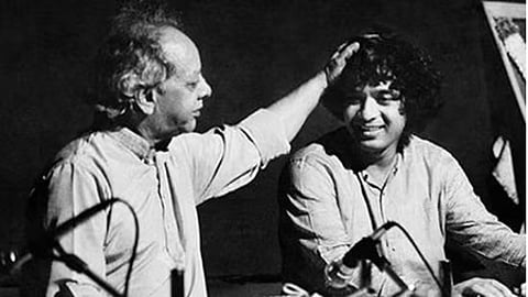 Tabla maestro Zakir Hussain on stage with his legendary father Allah Rakha in an old photo.