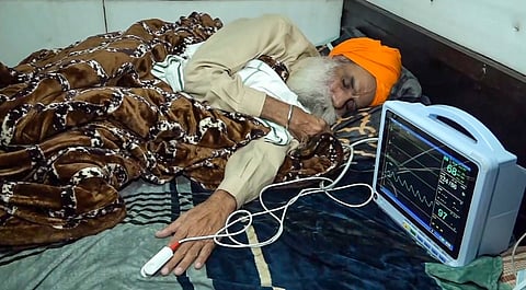 Farmer leader Jagjit Singh Dallewal rests during his hunger strike, at the Khanauri Border in Sangrur district, Monday, Dec. 23, 2024. 