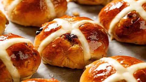 Hot cross buns aren’t just a sweet snack that appears around Easter. They carry centuries of storytelling in their dough.