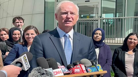 speaks to reporters outside a federal courthouse in Atlanta