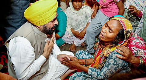 Punjab Chief Minister Bhagwant Mann meets the families of victims who died after consuming spurious liquor, in Amritsar.