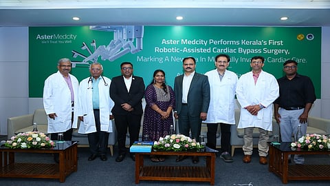 The patient, Nisha Purushothaman who has successffully undergone state’s first-ever robotic-assisted Coronary Artery Bypass Grafting (CABG) surgery,  with the surgery team at Aster Medcity