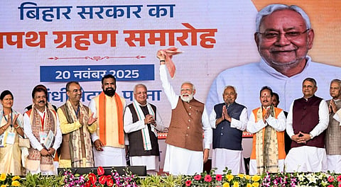Janata Dal (United) leader Nitish Kumar after taking oath as Bihar Chief Minister with his cabinet collegues and Prime Minister Narendra Modi pose for photograph, in Patna, Thursday, Nov. 20, 2025. 