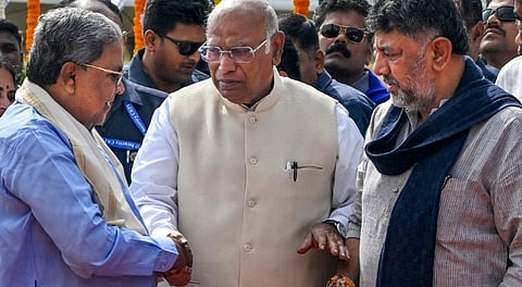Karnataka CM Siddaramaiah, state Deputy CM DK Shivakumar and Congress President Mallikarjun Kharge during an event marking BR Ambedkar's 69th death anniversary, observed as 'Mahaparinirvan Diwas', in Bengaluru, Saturday, Dec. 6, 2025. 