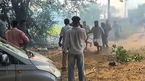 People gather at the site after the blast at a fireworks manufacturing unit in Mundathikode, Thrissur district, Kerala, Tuesday, April 21, 2026.