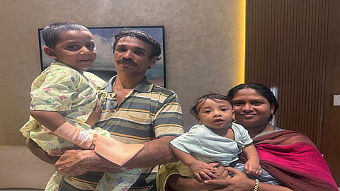 Emmanuel with his parents and younger brother