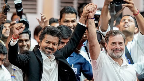Newly-elected Tamil Nadu Chief Minister and Tamilaga Vettri Kazhagam (TVK) chief C Joseph Vijay joins hands with Congress MP and Lok Sabha LoP Rahul Gandhi during the former's swearing-in ceremony, at Jawaharlal Nehru Stadium, in Chennai, Sunday, May 10, 2026.
