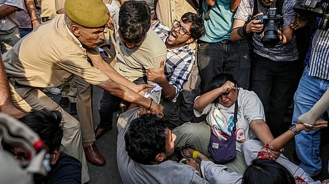 NSUI members stage a demonstration against the National Testing Agency (NTA) over alleged paper leak concerns following the cancellation of the NEET-UG 2026 examination, outside Shastri Bhawan, in New Delhi, Tuesday, May 12, 2026.
