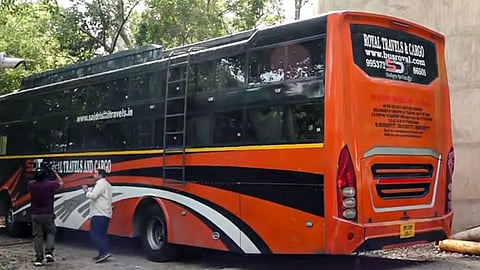 A private sleeper bus parked, in which a woman returning home from work in the Mangolpuri area was allegedly dragged and gang-raped by the driver and conductor, in New Delhi, Thursday, May 14, 2026.