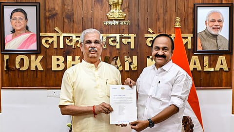 Kerala Governor Rajendra Vishwanath Arlekar receives the list of cabinet ministers from the Chief Minister-designate V D Satheesan ahead of the swearing-in ceremony, at the Lok Bhavan, in Thiruvananthapuram on May 17, 2026.