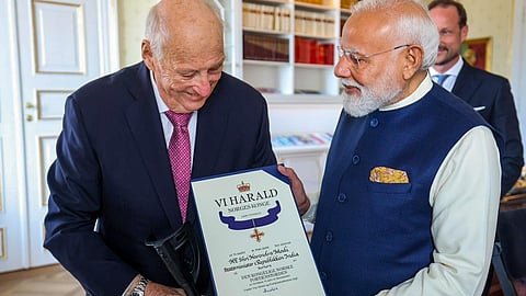 Prime Minister Narendra Modi, right, receives Norway's top honour, the Grand Cross of the Royal Norwegian Order of Merit, during a ceremony in Oslo, Norway on May 18, 2026.