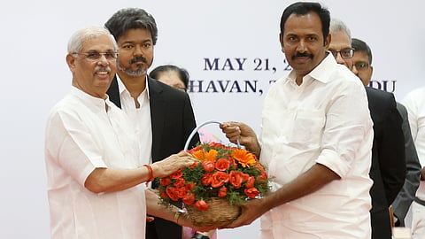 Tamil Nadu Governor Rajendra Vishwanath Arlekar and Chief Minister C Joseph Vijay felicitate Congress leader S Rajesh Kumar, who took oath of office as Tourism Minister, during the swearing-in ceremony of the new cabinet ministers at the Lok Bhavan, in Chennai, Thursday, May 21, 2026.