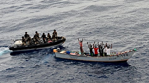 Personnel aboard a suspected pirate vessel during an anti-piracy operation by Indian Navy warship INS Kolkata near merchant vessel MV Mashallah 1 in the western Indian Ocean on May 27, 2026.