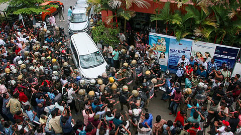 Left Democratic Front (LDF) activists attack the vehicle carrying Enforcement Directorate (ED) officials outside former Kerala CM Pinarayi Vijayan's residence after a raid conducted at Vijayan's residence as part of ED's investigation in the CMRL money laundering case, in Thiruvananthapuram, Wednesday, May 27, 2026.