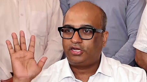 NTA Director General Abhishek Singh addresses a press conference regarding the cancellation of NEET-UG 2026 held on May 3 following allegations of irregularities and a paper leak, in New Delhi, Tuesday, May 12, 2026. 