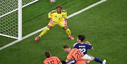 Daichi Kamada's late header gives Japan a 2-2 draw with Netherlands in World Cup opener for both