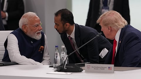 India's Prime Minister Narenda Modi talks to U.S. President Donald Trump before the plenary session at the G7 summit, Tuesday, June 16, 2026, in Evian-les-Bains, France.