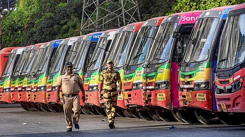 Security personnel keep vigil on the second day of an indefinite strike by the employees of the Brihanmumbai Electric Supply and Transport (BEST) over various demands, in Mumbai, Maharashtra, Saturday, June 20, 2026. 