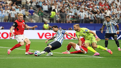 Messi sets World Cup scoring record as defending champion Argentina advances to knockout stage