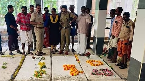 Police and locals gathered at the Infant Jesus Church cemetery in Vaniyappara.