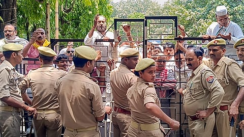 Congress workers protest outside the district headquarters over the alleged theft of donation deeds linked to the Shri Ram Temple in Ayodhya, in Varanasi, Wednesday, June 24, 2026.