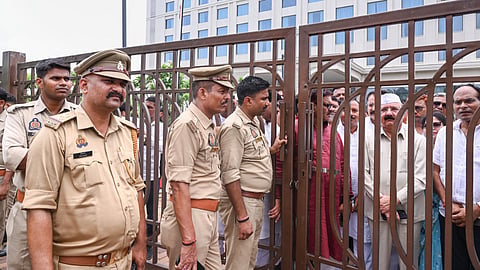 Police personnel stand guard outside the hotel after Congress delegation, including party MP Kishori Lal Sharma, were placed under house arrest ahead of their proposed visit to offer prayers at the Ram Temple amid the ongoing controversy over alleged embezzlement of temple funds, in Ayodhya, Uttar Pradesh, Tuesday, June 30, 2026.