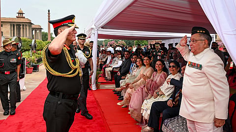 General Dhiraj Seth salutes his father and Lt. Gen. (Retd) Krishna Mohan Seth, who retired in 1997 after a distinguished career that included commanding the XXI Strike Corps and the III Corps, during a ceremony marking the former's assumption of charge as the new Chief of the Army Staff (COAS), at the South Block, in New Delhi.