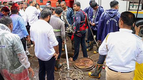 Rescue operation underway after a 55-year-old man died after falling into an open manhole amid heavy rain, in Mumbai, Thursday, July 2, 2026.
