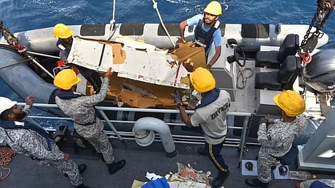 Pakistan Navy personnel shift the wreckage of a cargo plane of the private carrier K2 Airways into a naval ship after recovering them from deep sea near Omara, a town some 360 kms. (220 miles) west of Karachi
