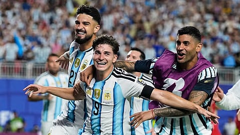 Argentina’s Julian Alvarez (9) is congratulated by teammates after scoring his team’s second goal during the World Cup quarterfinal soccer match between Argentina and Switzerland in Kansas City, Mo., Saturday, July 11, 2026.