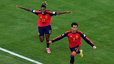 Spain's Ferran Torres (7) celebrates after scoring the opening goal of his team during the World Cup final soccer match between Spain and Argentina in East Rutherford, N.J., near New York, Sunday.