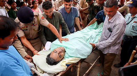 Officials carry the mortal remains of Tripura Director General of Police (DGP) Anurag Dhankar after he was found dead at his office, in Agartala, Monday, July 20, 2026.