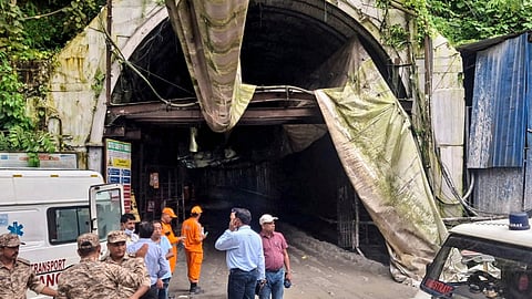 Officials and rescue workers in front of  the under-construction NHPC Teesta Stage VI Hydroelectric Project tunnel, in Namchi, Tuesday, July 21, 2026.