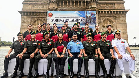 Members of 'IASV Triveni' in a group photograph with military personnel as they were received during the concluding ceremony of the first-ever tri-services all-women circumnavigation sailing expedition, 'Samudra Pradakshina', after spending over 10 months at sea, at the Gateway of India, in Mumbai, Maharashtra, Wednesday, July 22, 2026.
