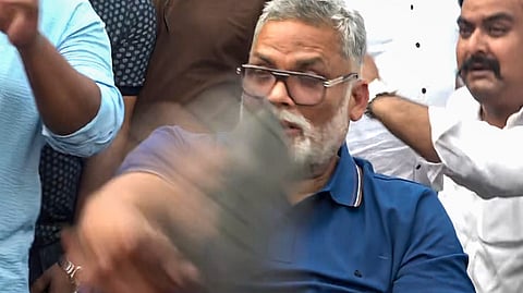 Independent MP Pappu Yadav addresses the media, in New Delhi, Sunday, Aug. 2, 2026. A man hurled a slipper at Yadav during the press conference.