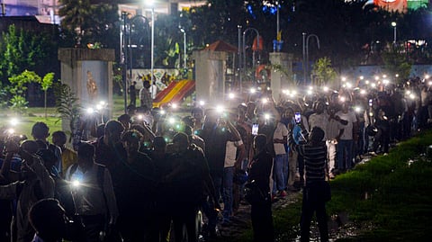 Students use mobile torches during a protest against the Jharkhand government over alleged irregularities in examinations conducted by the Jharkhand Public Service Commission (JPSC) and the Jharkhand Staff Selection Commission (JSSC), in Ranchi, Jharkhand, Monday, Aug. 3, 2026.