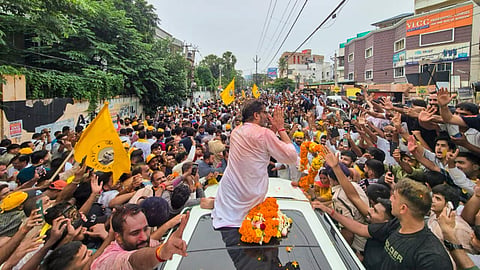 Jan Suraaj Party chief Prashant Kishor celebrates with supporters after taking the lead in the Bankipur Assembly by-election during the counting of votes, in Patna, Monday, Aug. 3, 2026.