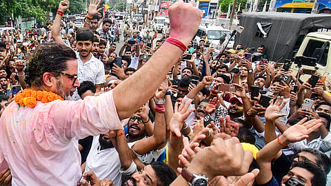 Jan Suraaj Party chief Prashant Kishor celebrates with supporters after taking the lead in the Bankipur Assembly by-election during the counting of votes, in Patna, Monday, Aug. 3, 2026.