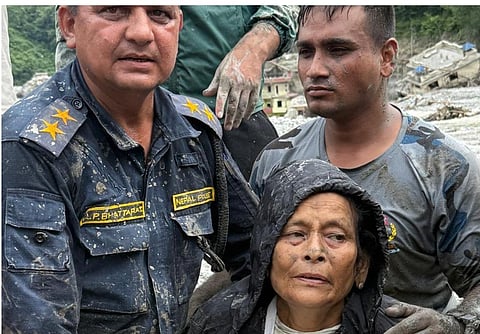 Nepal floods: Woman’s rescue after 10 days in mud and debris renews hope for the missing